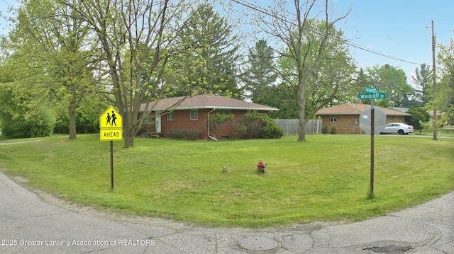 5120 Wardcliff Dr, East Lansing, MI 48823 - view of front of home featuring brick siding