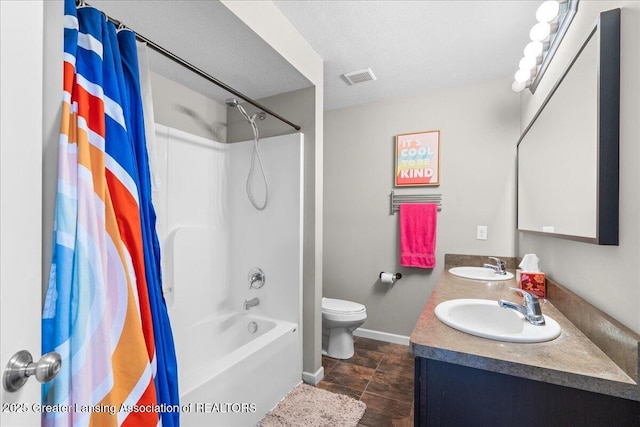 bathroom with toilet, baseboards, shower / bathtub combination with curtain, and double vanity