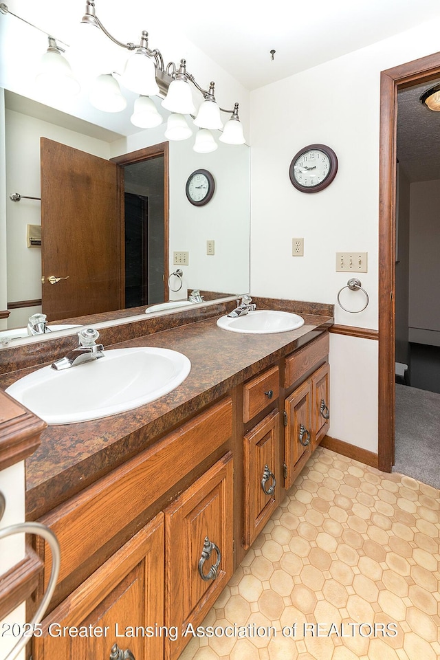 full bathroom with tile patterned floors and double vanity