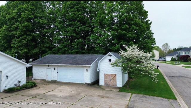 garage with concrete driveway