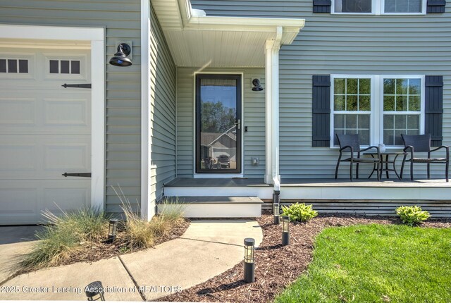 3793 Calypso Rd, Holt, MI 48842 - entrance to property featuring a garage