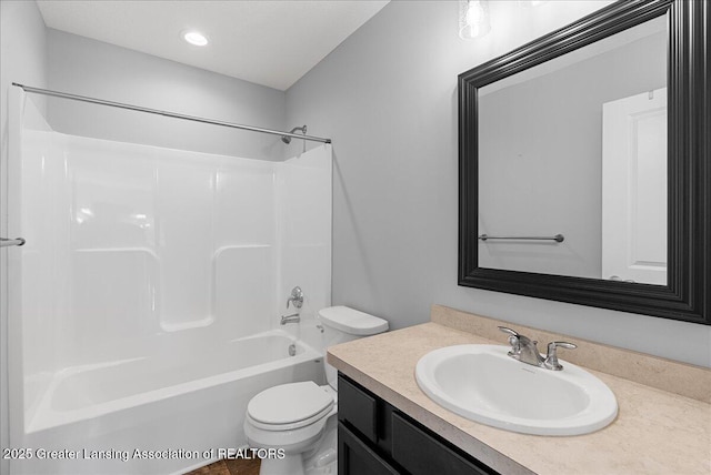 4535 Harper Rd, Holt, MI 48842 - full bath featuring toilet, vanity,  shower combination, and recessed lighting
