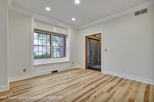3650 Observatory Ln, Holt, MI 48842 - spare room featuring light wood-style floors, recessed lighting, crown molding, and baseboards