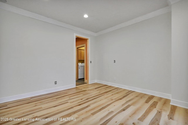 3650 Observatory Ln, Holt, MI 48842 - unfurnished room featuring washer / clothes dryer, ornamental molding, baseboards, recessed lighting, and wood finished floors