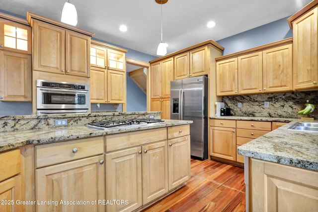 3650 Observatory Ln, Holt, MI 48842 - kitchen featuring stainless steel appliances, light brown cabinetry, light wood-style floors, and recessed lighting