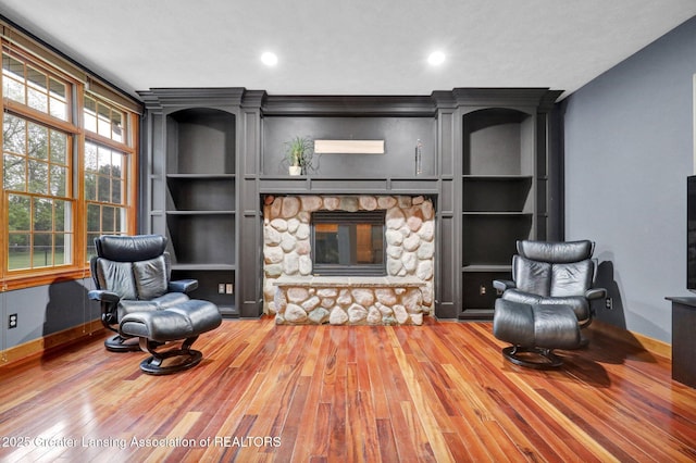 3650 Observatory Ln, Holt, MI 48842 - living room with a fireplace, wood finished floors, baseboards, and recessed lighting