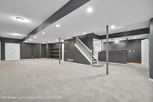3650 Observatory Ln, Holt, MI 48842 - finished below grade area featuring stairway, carpet, baseboards, and recessed lighting