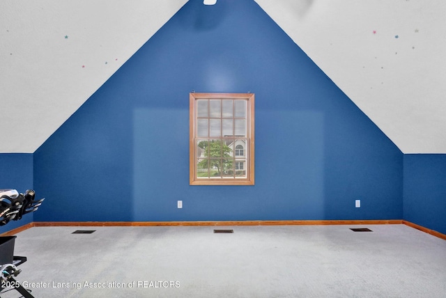3650 Observatory Ln, Holt, MI 48842 - bonus room featuring carpet flooring, vaulted ceiling, and baseboards