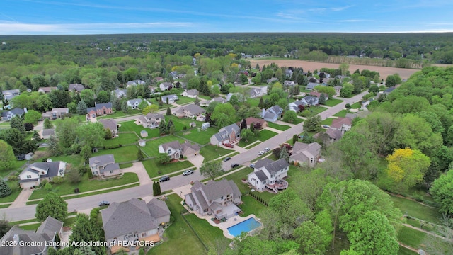 3650 Observatory Ln, Holt, MI 48842 - aerial overview of property's location with a heavily wooded area and nearby suburban area