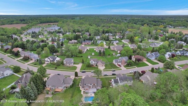 3650 Observatory Ln, Holt, MI 48842 - aerial overview of property's location with nearby suburban area and a heavily wooded area