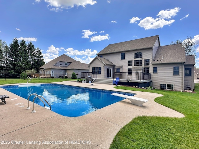 3650 Observatory Ln, Holt, MI 48842 - view of pool featuring a diving board, a patio, a deck, and a yard