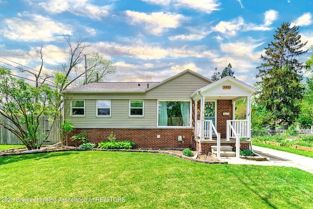 2531 Dillingham Ave, Lansing, MI 48906 - view of front of property with a front yard and brick siding