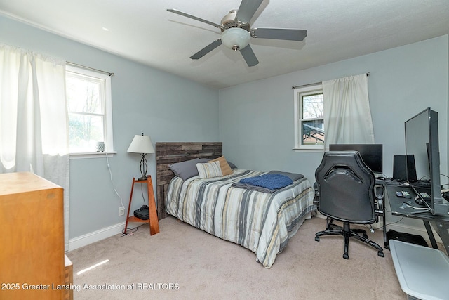2531 Dillingham Ave, Lansing, MI 48906 - carpeted bedroom featuring baseboards, an office area, and a ceiling fan