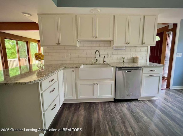 kitchen featuring dishwasher, dark wood-type flooring, white cabinets, and backsplash