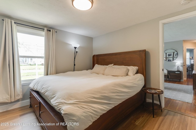 316 Union St, Grand Ledge, MI 48837 - bedroom featuring light wood-style flooring and baseboards