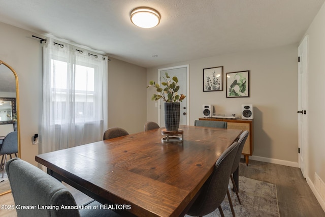 316 Union St, Grand Ledge, MI 48837 - dining area featuring wood finished floors and baseboards