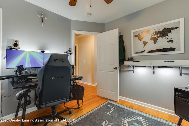 316 Union St, Grand Ledge, MI 48837 - home office with light wood finished floors, ceiling fan, and baseboards