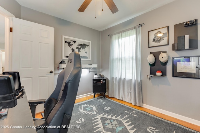 316 Union St, Grand Ledge, MI 48837 - home office featuring a ceiling fan, wood finished floors, and baseboards