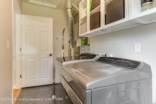 316 Union St, Grand Ledge, MI 48837 - laundry area with cabinet space and washing machine and dryer