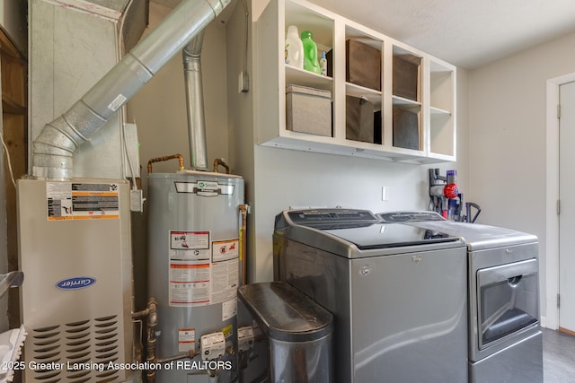316 Union St, Grand Ledge, MI 48837 - washroom featuring water heater and independent washer and dryer