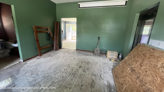 413 Meeker St, Leslie, MI 49251 - empty room featuring wood finished floors and high vaulted ceiling