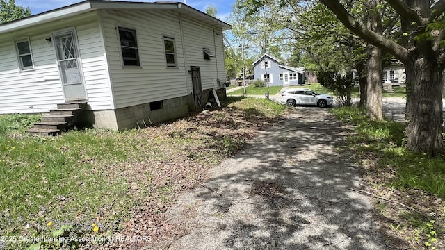 413 Meeker St, Leslie, MI 49251 - view of side of property with entry steps and driveway
