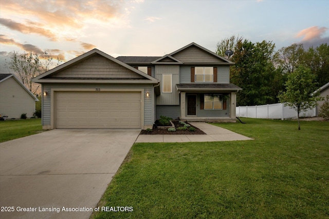 703 Josie Ln, Laingsburg, MI 48848 - view of front of home featuring an attached garage and concrete driveway