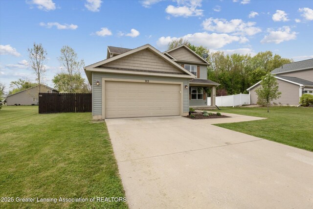 703 Josie Ln, Laingsburg, MI 48848 - view of front of home featuring an attached garage and driveway