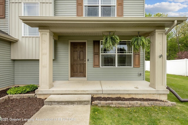 703 Josie Ln, Laingsburg, MI 48848 - doorway to property with covered porch and board and batten siding