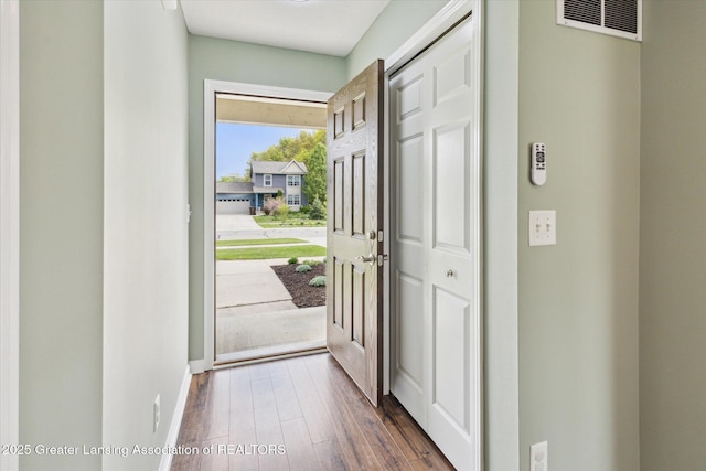 703 Josie Ln, Laingsburg, MI 48848 - foyer with dark wood-style flooring and baseboards