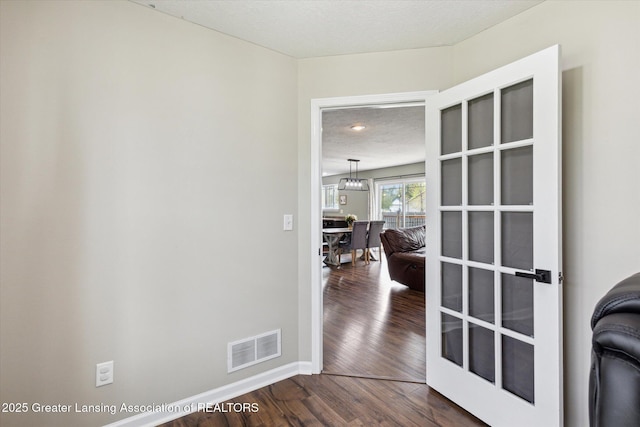 703 Josie Ln, Laingsburg, MI 48848 - spare room with dark wood-style flooring, baseboards, and a textured ceiling