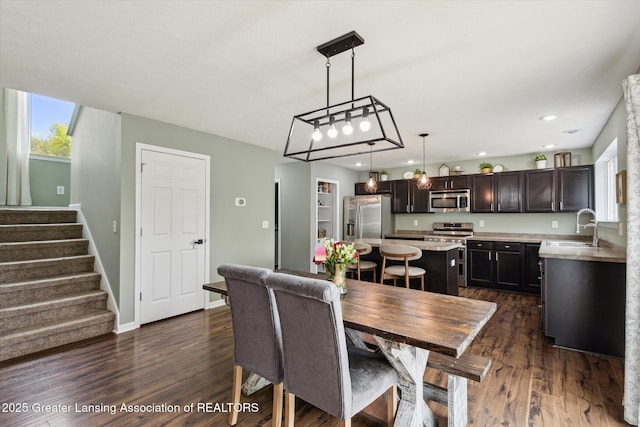 703 Josie Ln, Laingsburg, MI 48848 - dining space featuring healthy amount of natural light, dark wood-type flooring, stairs, and recessed lighting