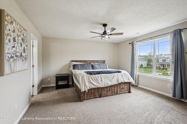 703 Josie Ln, Laingsburg, MI 48848 - bedroom featuring carpet flooring, baseboards, a textured ceiling, and a ceiling fan