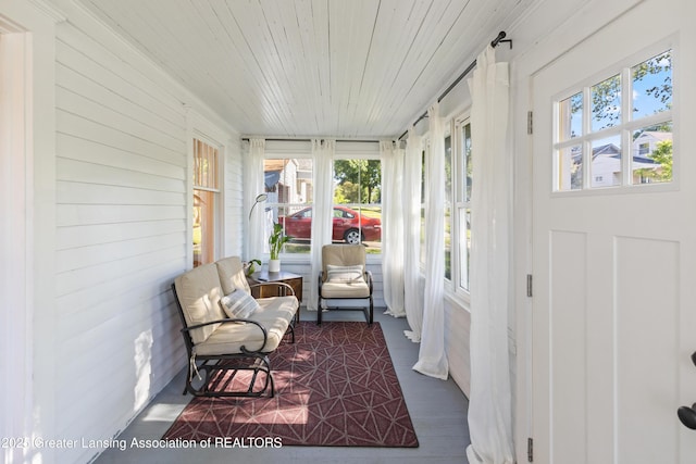 1038 Morgan St, Lansing, MI 48912 - sunroom / solarium featuring healthy amount of natural light, wooden ceiling, and wood walls