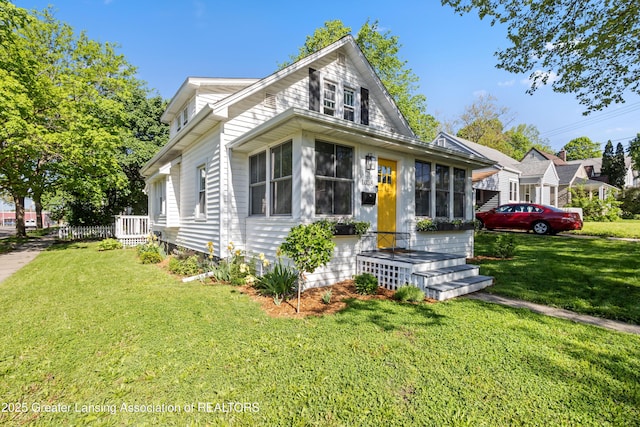 1038 Morgan St, Lansing, MI 48912 - bungalow-style house featuring a front yard