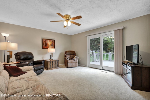 10079 Woodland Acres Dr, Grand Ledge, MI 48837 - living area with light colored carpet, ceiling fan, and a textured ceiling