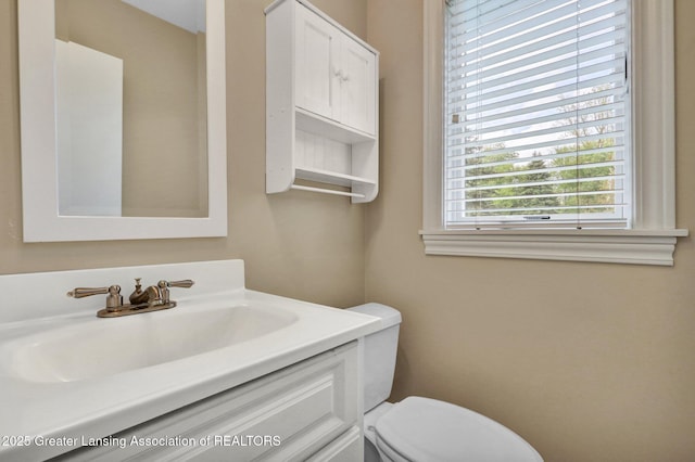 10079 Woodland Acres Dr, Grand Ledge, MI 48837 - half bath featuring toilet and vanity