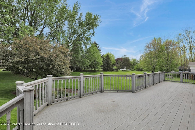 10079 Woodland Acres Dr, Grand Ledge, MI 48837 - wooden deck featuring a lawn and view of wooded area