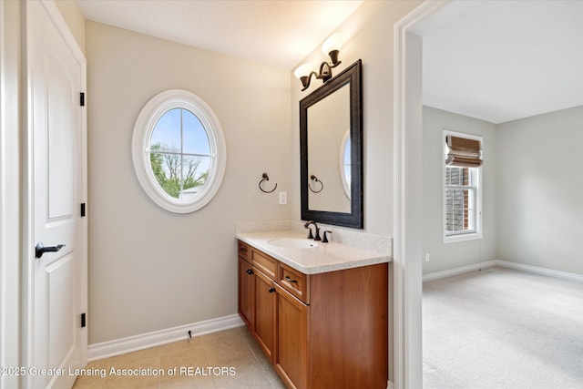 bathroom featuring vanity and baseboards