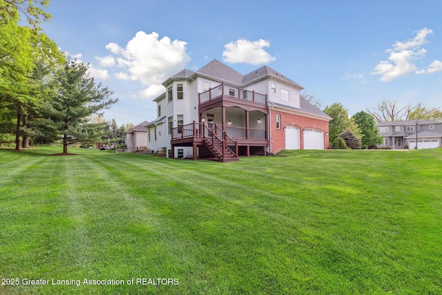 back of property with stairs, a yard, a balcony, and a wooden deck
