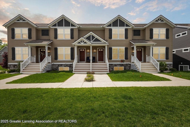 3842 Fossum Ln, Okemos, MI 48864 - townhome / multi-family property featuring a front yard and roof with shingles