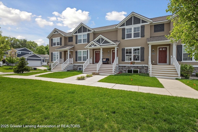 3842 Fossum Ln, Okemos, MI 48864 - townhome / multi-family property with a front lawn and roof with shingles