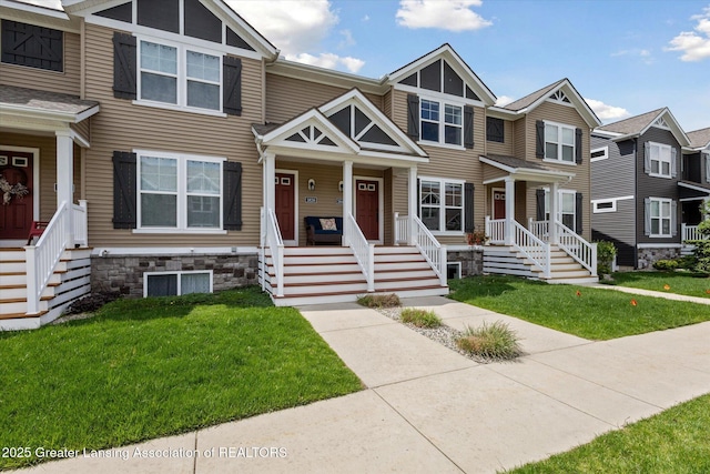 3842 Fossum Ln, Okemos, MI 48864 - multi unit property with a front yard and a porch