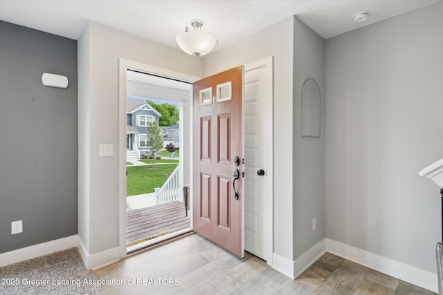 3842 Fossum Ln, Okemos, MI 48864 - entrance foyer with baseboards and light wood-style floors