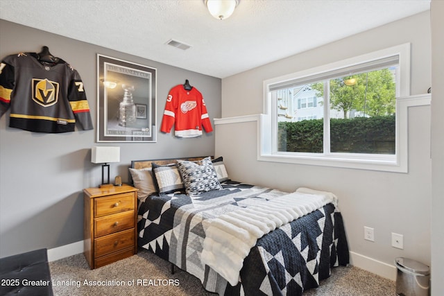 3842 Fossum Ln, Okemos, MI 48864 - carpeted bedroom featuring baseboards and a textured ceiling