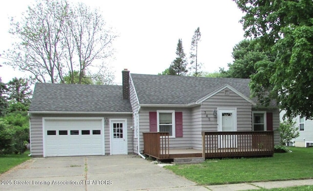 745 Roosevelt St, Mason, MI 48854 - view of front facade with concrete driveway, an attached garage, a chimney, a front yard, and roof with shingles