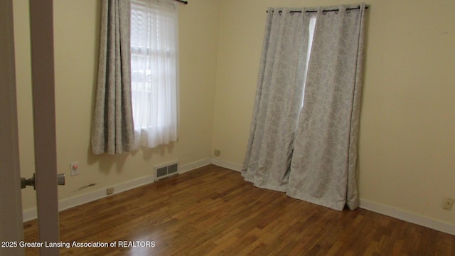 745 Roosevelt St, Mason, MI 48854 - spare room with wood finished floors and baseboards