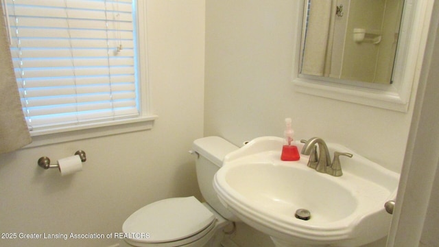745 Roosevelt St, Mason, MI 48854 - half bath featuring a sink and toilet