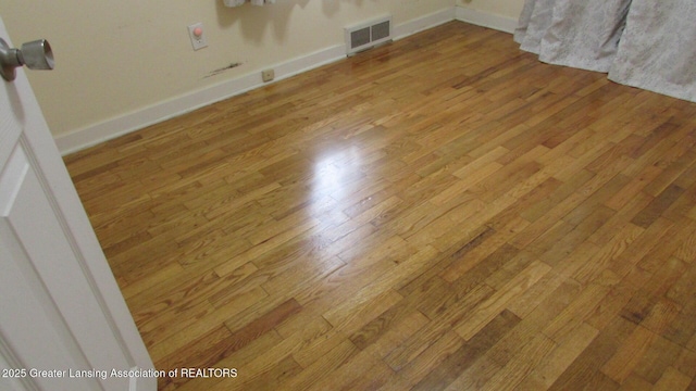 745 Roosevelt St, Mason, MI 48854 - detailed view of wood finished floors and baseboards