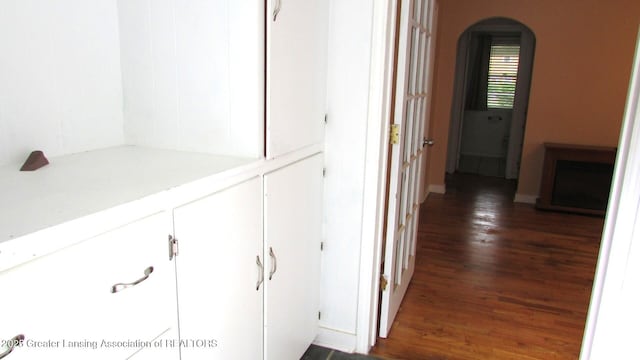745 Roosevelt St, Mason, MI 48854 - hallway with wood finished floors and arched walkways